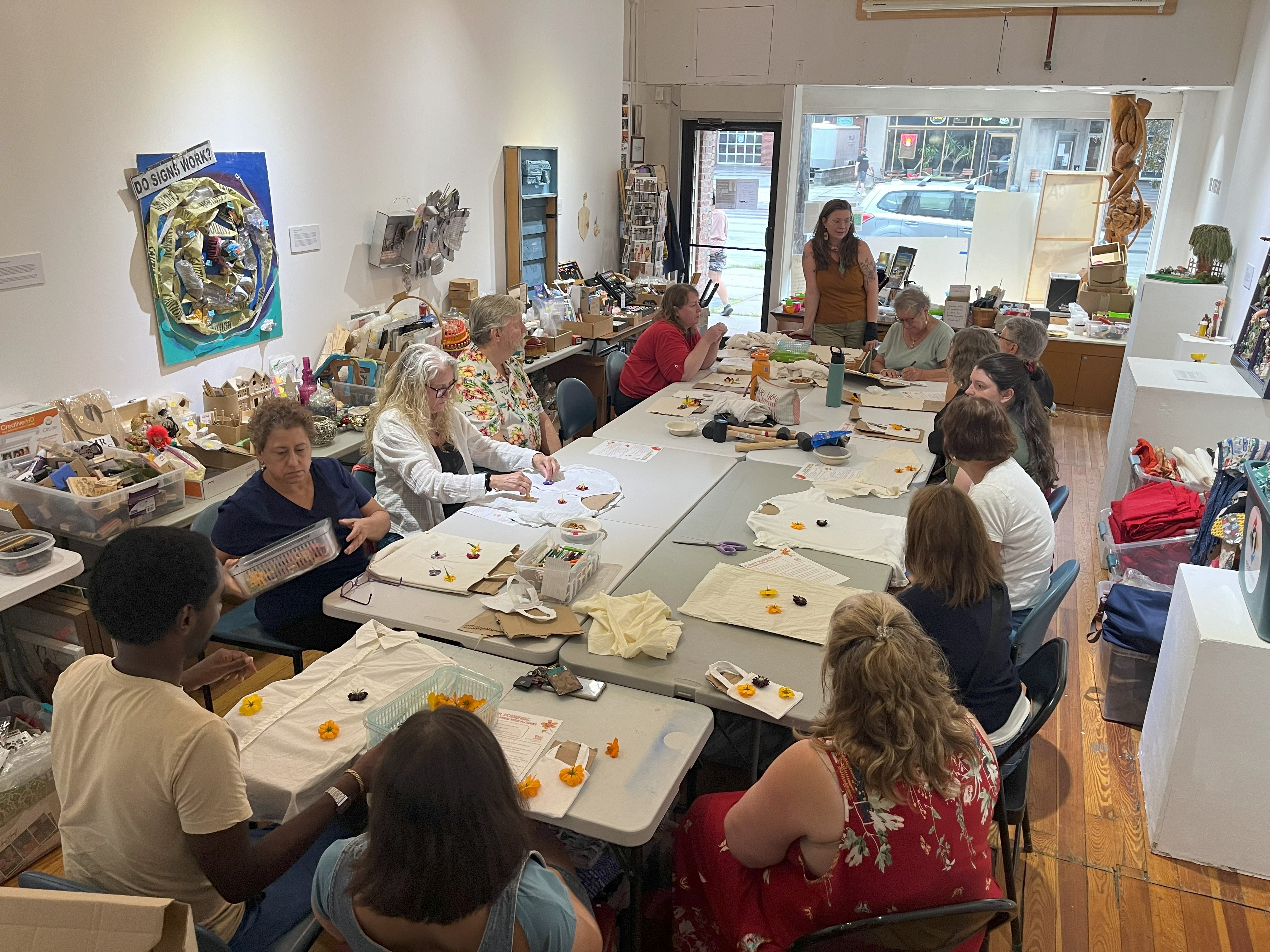 Class learns how to print designs by pounding flowers onto fabric