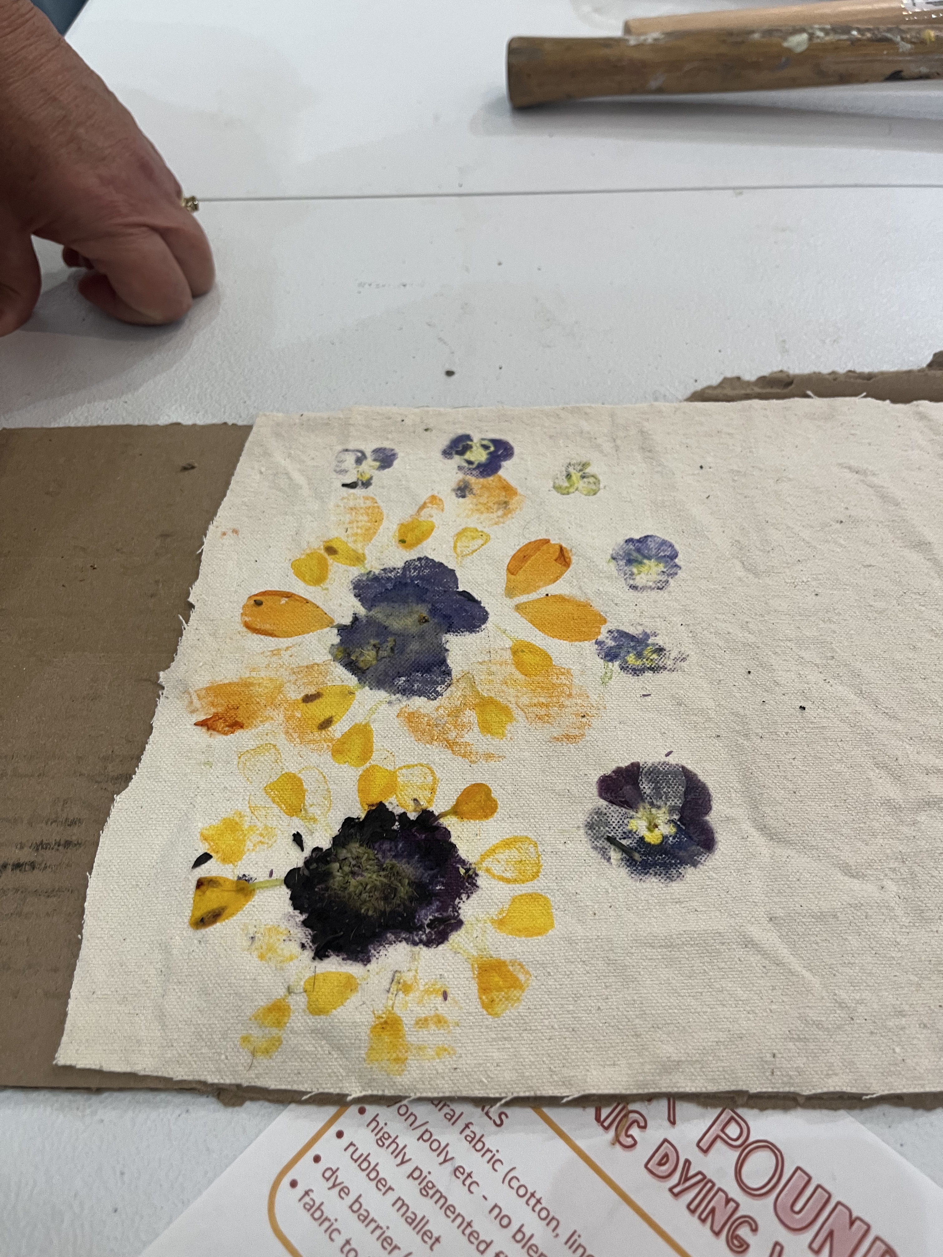 Yellow and purple flower printing on white fabric