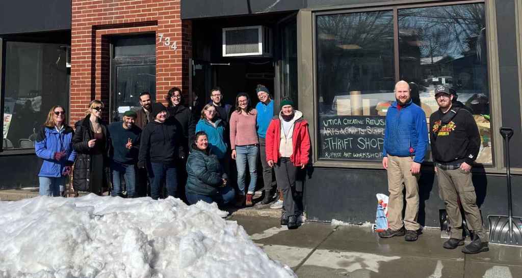 Group photo of Moving Day Volunteers in front of Utica Creative Reuse at 734 Columbia St, Utica NY
