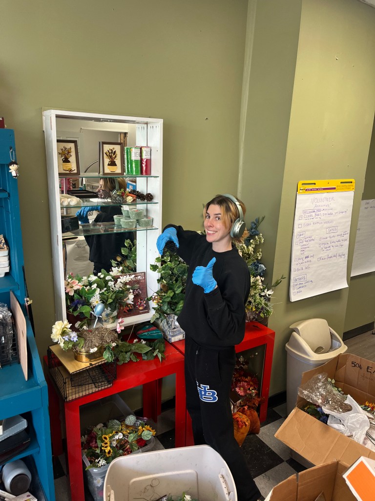Volunteer sorting faux flowers