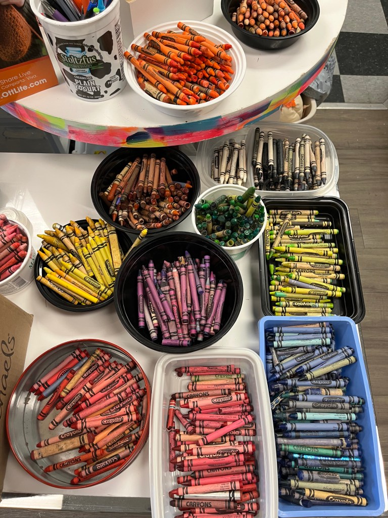 Used crayons sorted by color